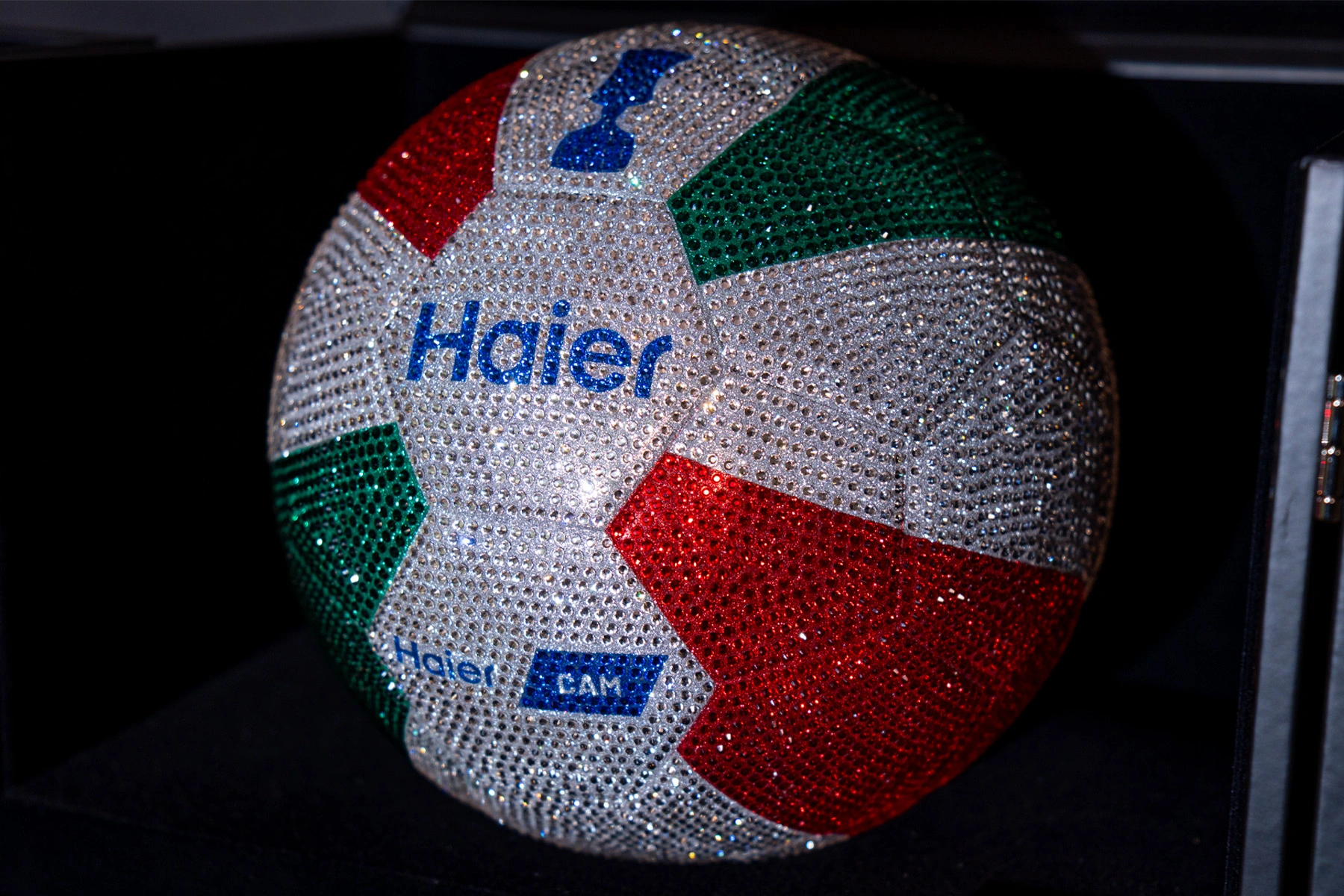 Detail of luxury football covered with Swarovski crystals, featuring Haier branding, Haier Cam logo and the the Coppa Italia.